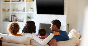 family in front of a tv. desinations 0820