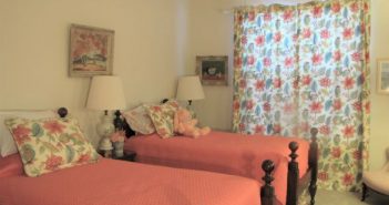 Don’t Let a Heat Wave Make Utility Bills Boil Over retro bedroom with a ceiling fan
