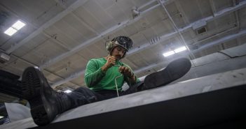 sailor conducts maintenance