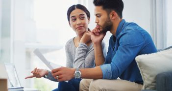 couple reviewing documents, finances