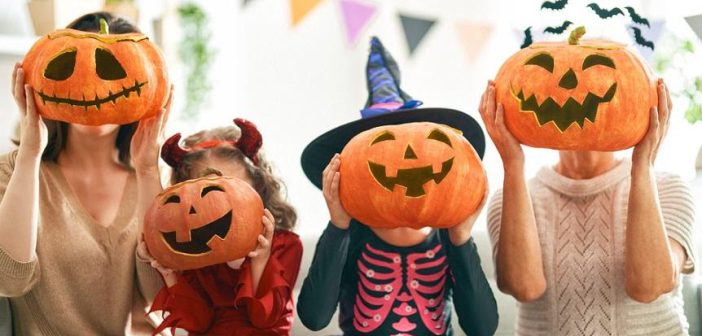 Halloween, pumpkins, kids wearing pumpkin heads