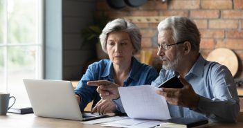 older couple reviewing paperwork