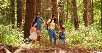 family hiking in the woods