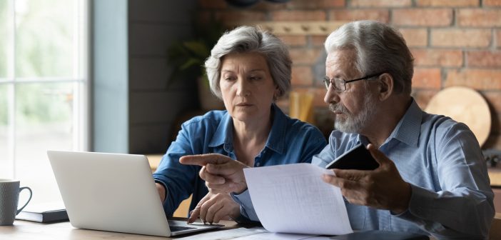 older couple reviewing paperwork