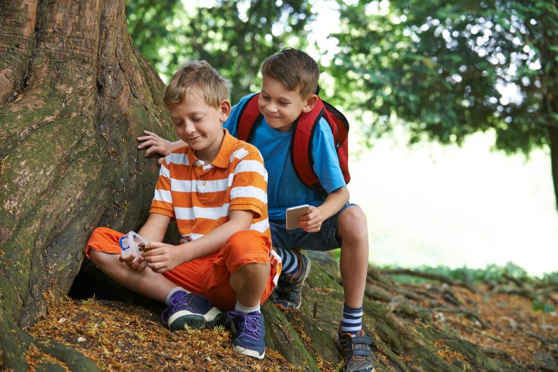 young boys geocaching
