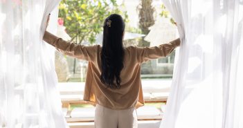 woman at open window, let fresh air in