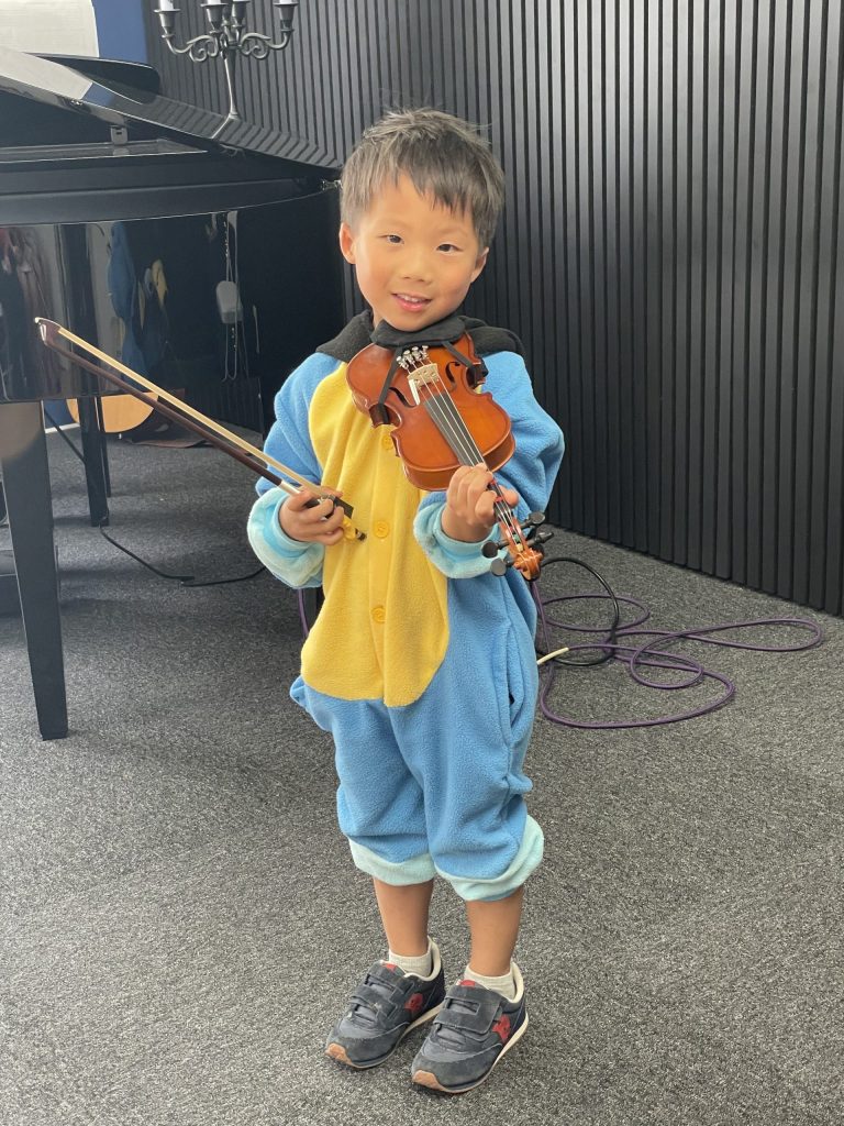 little boy holding a violin, Prince William Music Academy