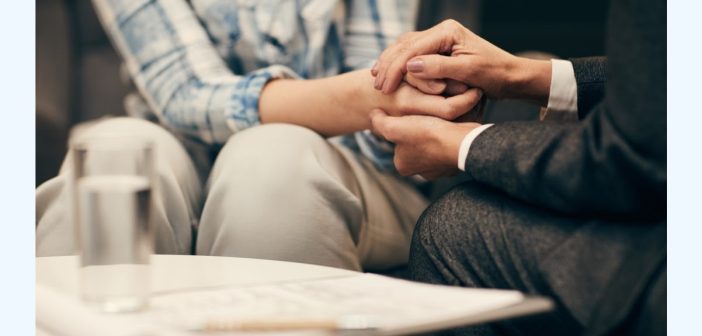 people holding hands in support